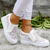 Andningsaktiva low-top sneakers med blommigt mönster