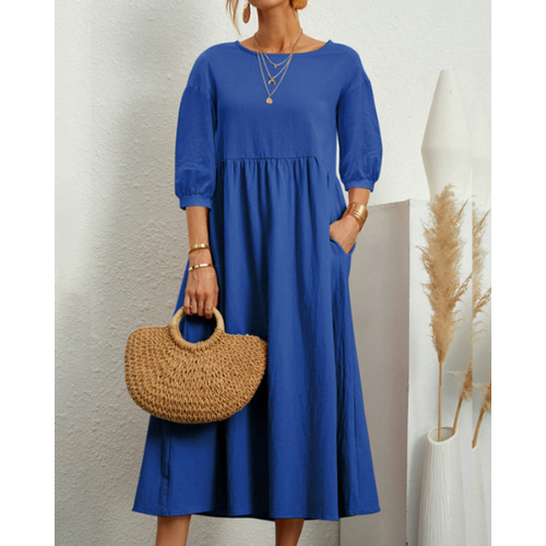 Elegant sommerkjole med smock og romantiske detaljer