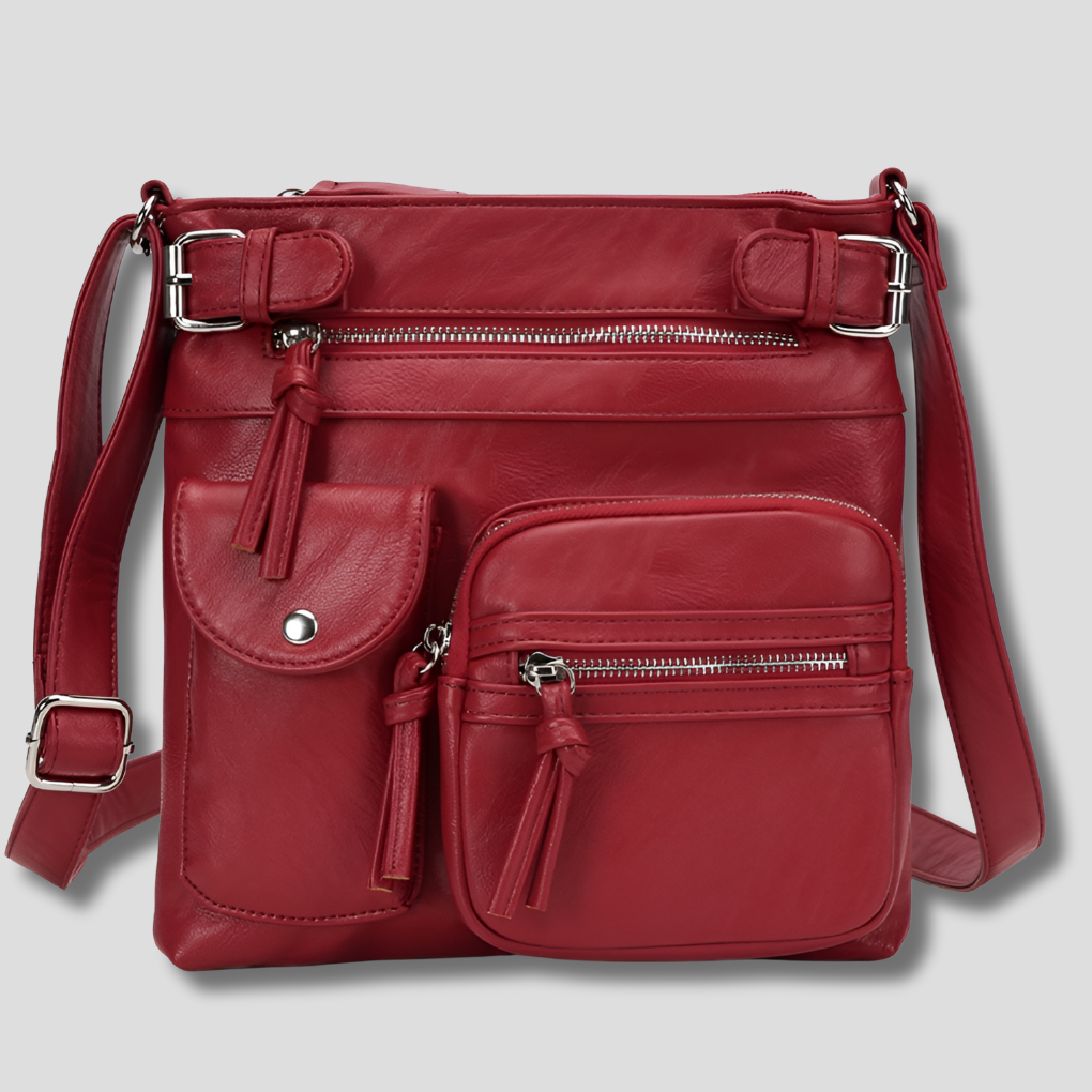 Damväska i syntetiskt tyg med flera fickor