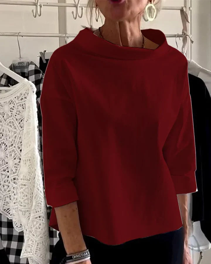 Avslappnad topp med vida uppslag och halv polokrage för en stilfstickad struktur look