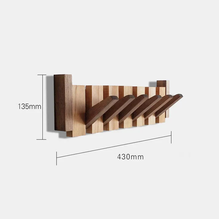 Elegant väggmonterad klädhängare i trä med pianodesign
