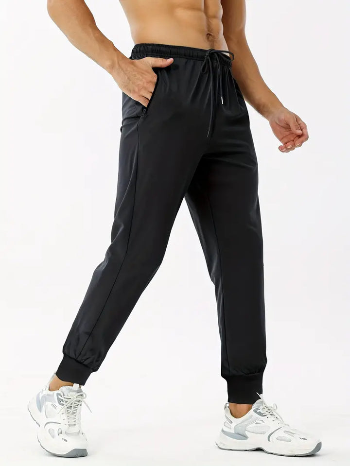 Joggers med bokstavstryck och fickor med dragkedja